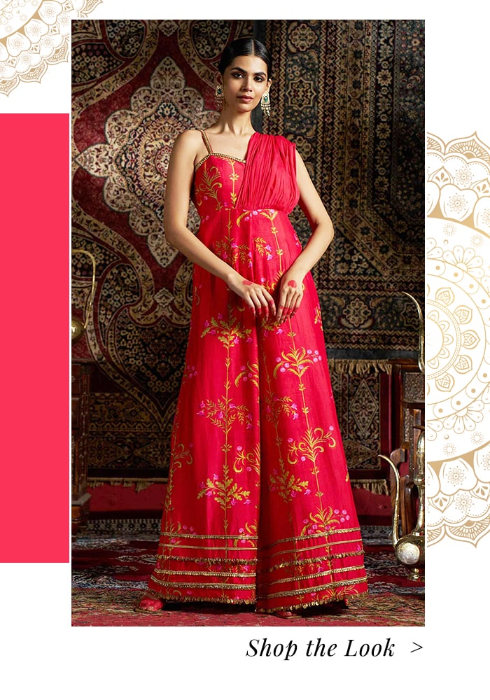 Model wearing a red embroidered jumpsuit