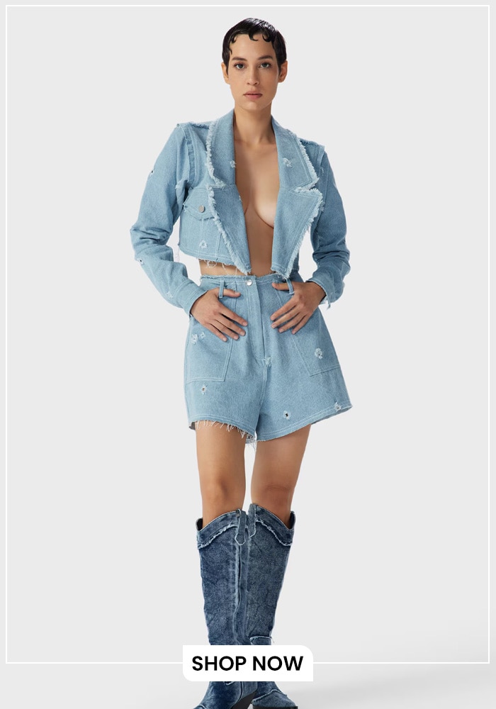 Model wearing blue denim tilly shorts with front open blue denim shirt
