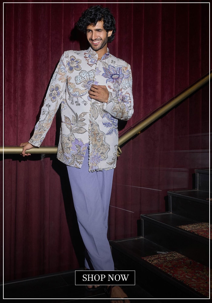 Model wearing a lavendar floral bandhgala set 