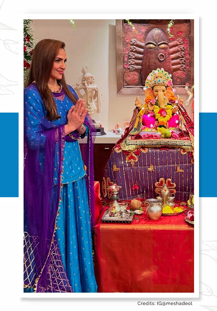 Esha Doel in a blue lehenga choli praying to Lord Ganesh