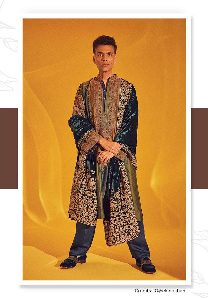 Karan Johar in a long embroidered kurta and velvet stole