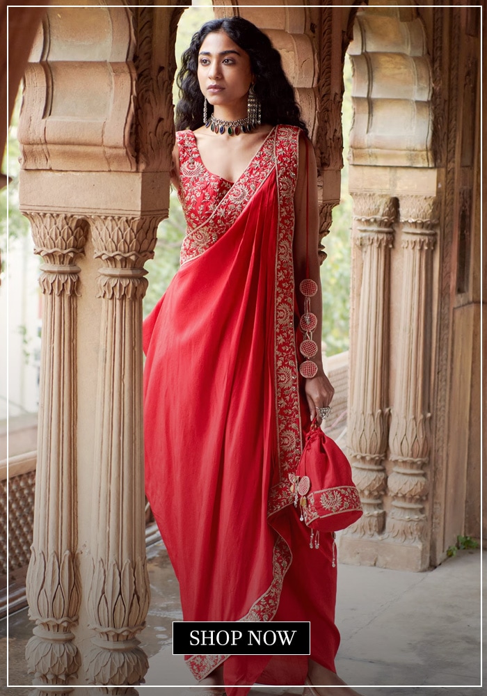 Model wearing red silk pre-draped saree with blouse