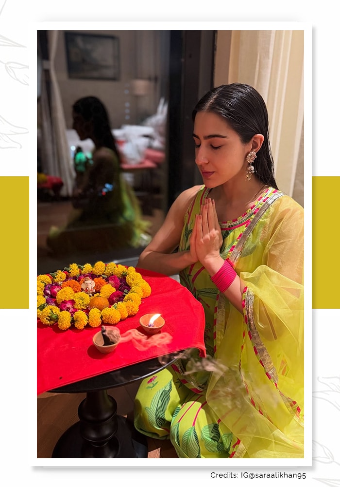 Sara Ali Khan in a lime green sleeveless kurta and dupatta praying to Lord Ganesh