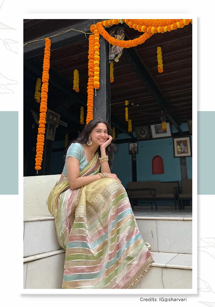 Sharvari wearing a peach striped saree