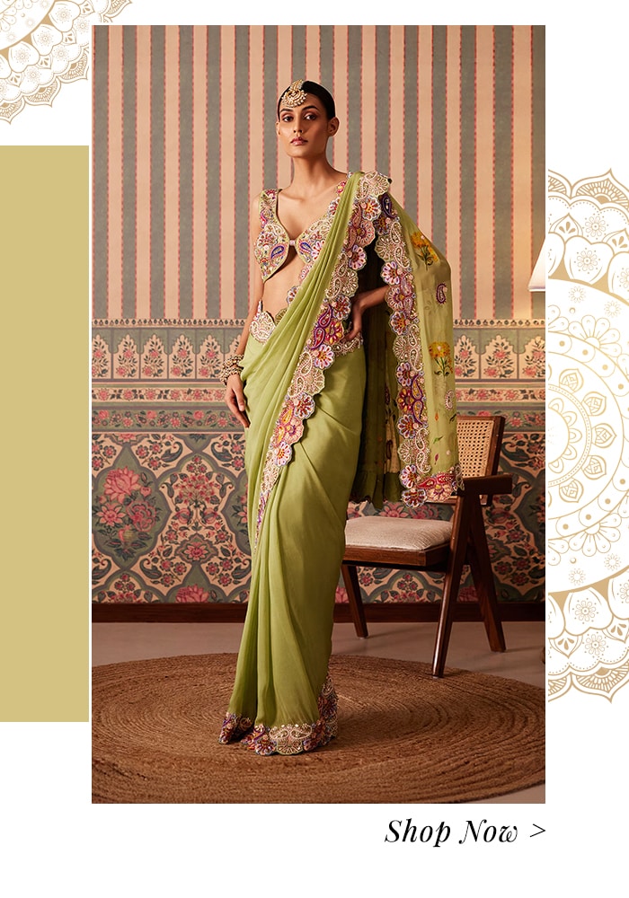 Model wearing a crystal and bead embroidered green hand painted saree