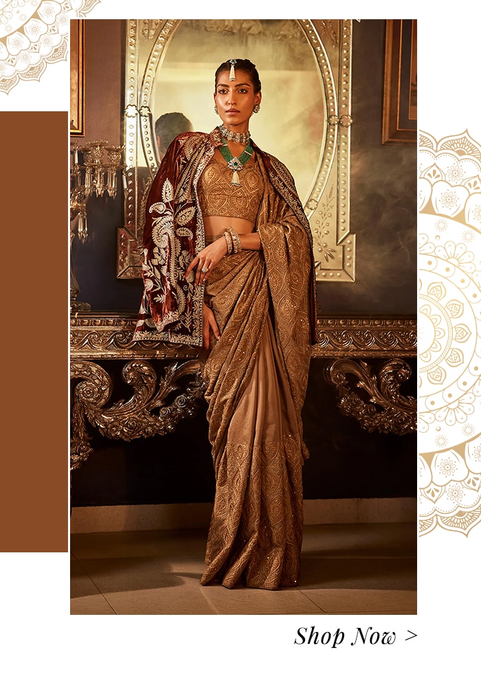 Maroon jacket and beige saree