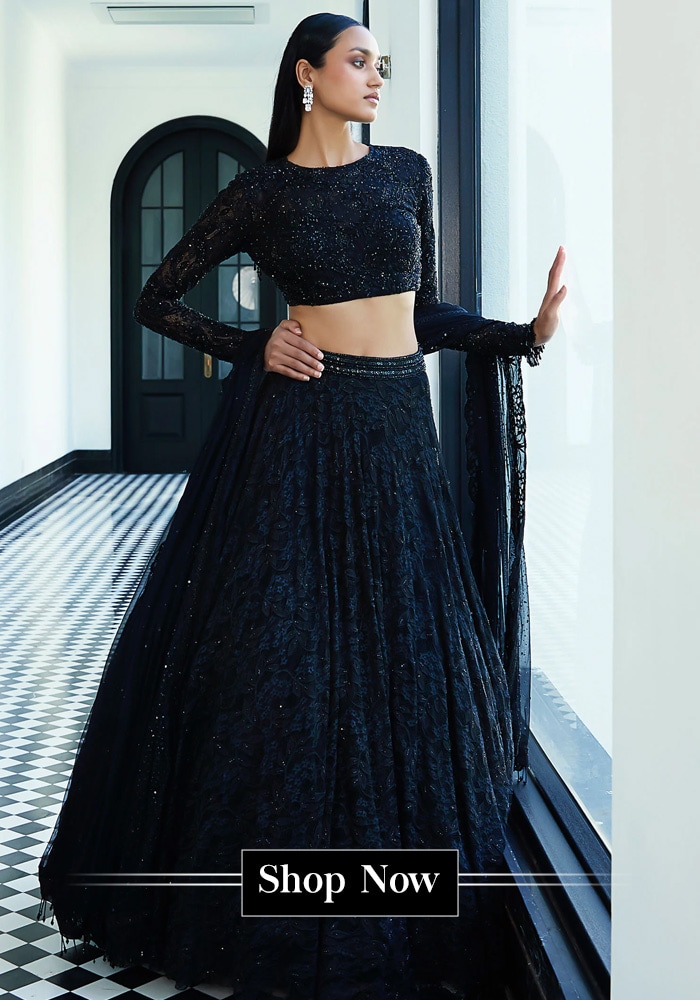 Model wearing a black lehenga