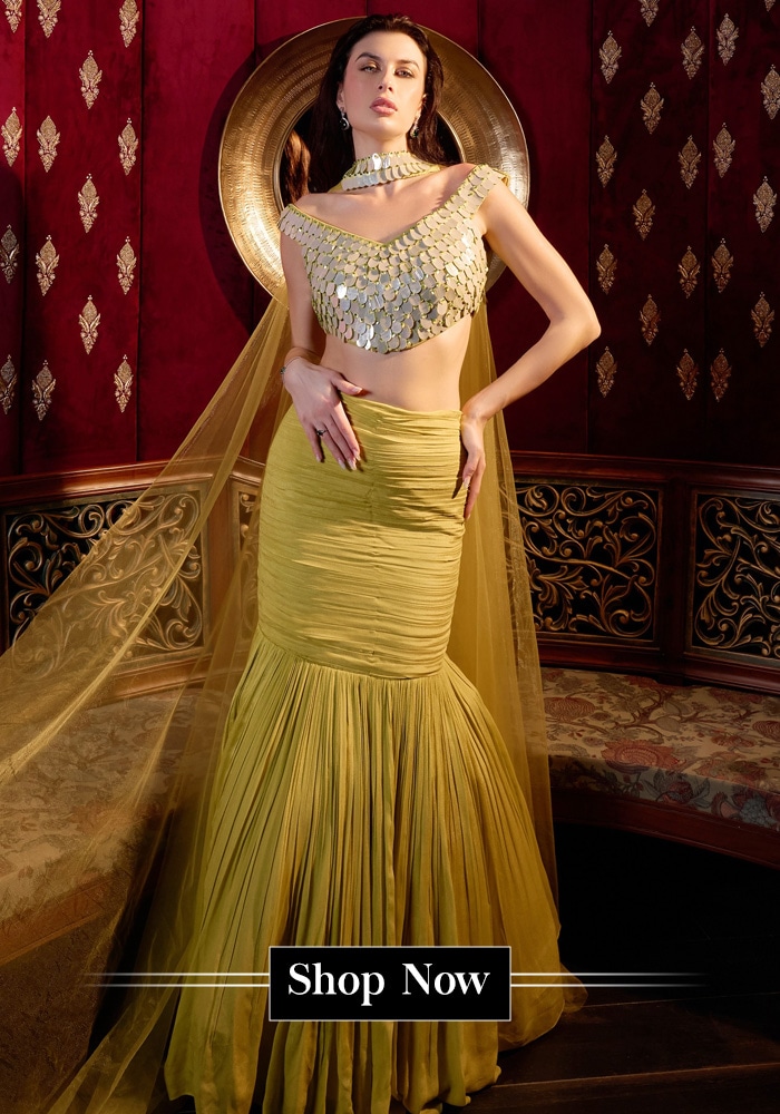 Model wearing a green fishcut style lehenga