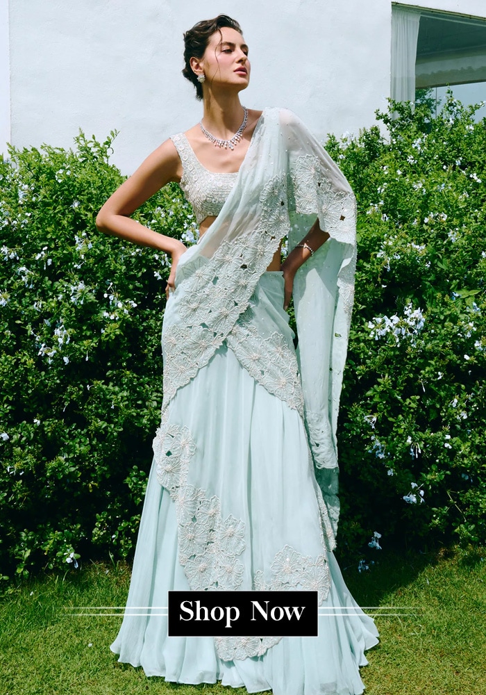 Model wearing a sky blue lehenga saree