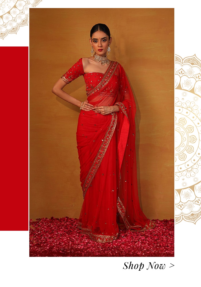 Model wearing red embroidered saree