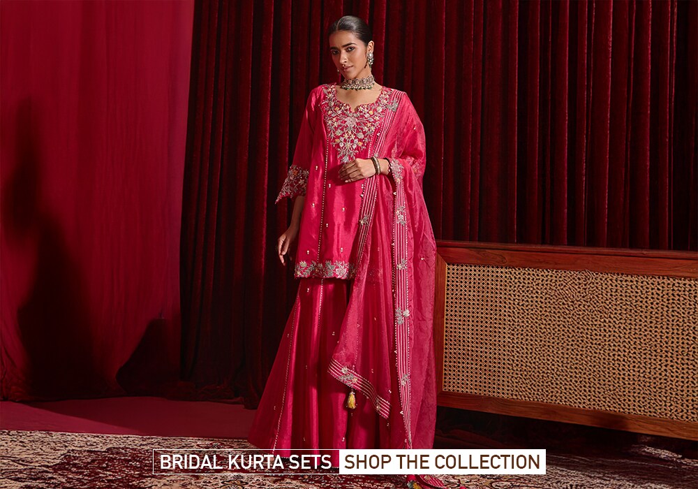 Model wearing a pink sharara set