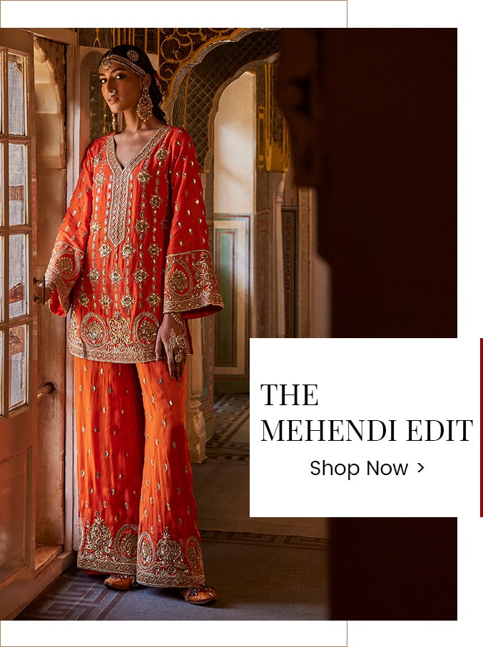 Mode wearing an orange kurta set