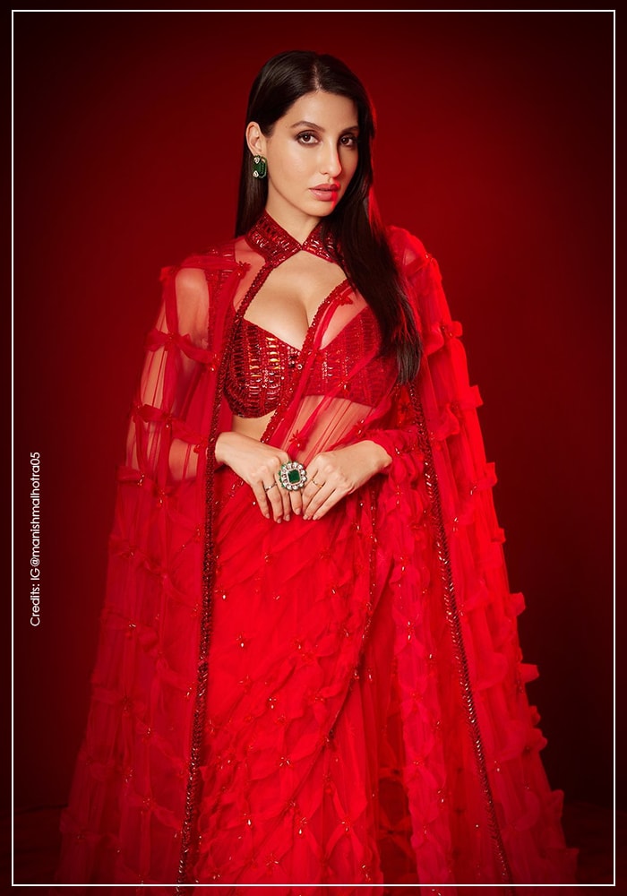 Nora Fatehi wearing signature Manish Malhotra saree