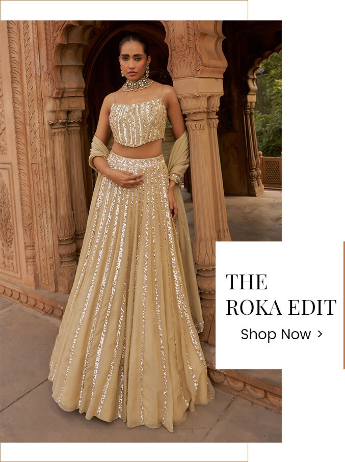 Model wearing a silver lehenga