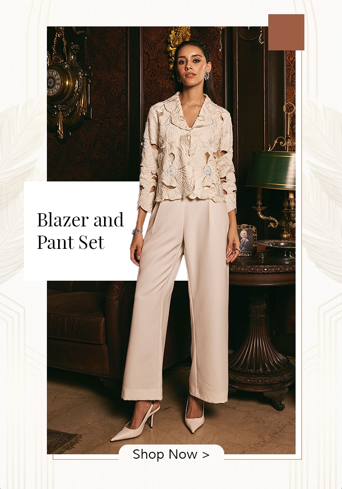 Model wearing ivory blazer and pant set