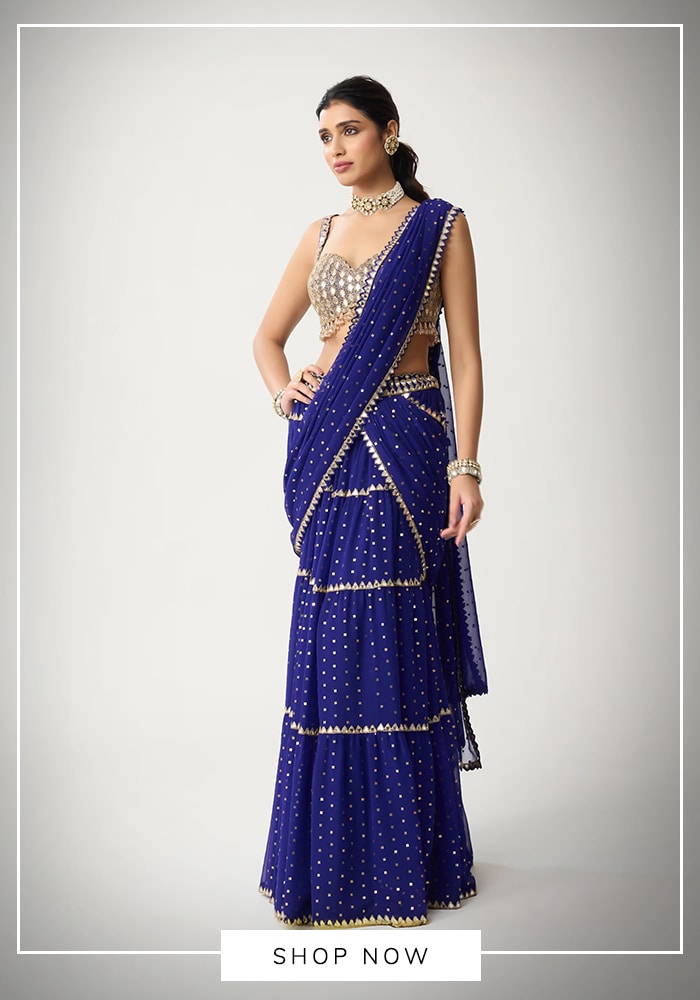 15 Showstopping Bridal Sarees Everyone Is Talking About Right Now 3 Model wearing blue sequin tiered lehenga saree in mirror work