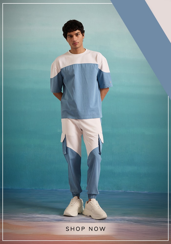 Men’s Day: How Modern Menswear Defines the New Age Gentleman 8 Model wearing white and blue colorblock jogger and sweatshirt set