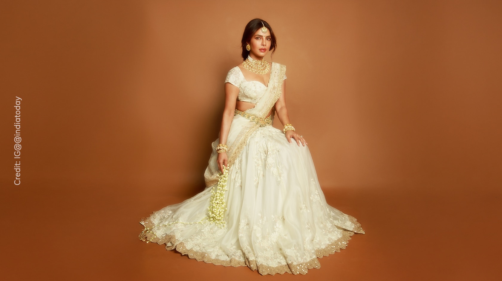 Priyanka Chopra wearing white Anamika Khanna lehenga saree