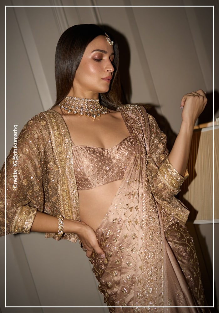 Alia Bhatt in Ritu Kumar gold jacket saree