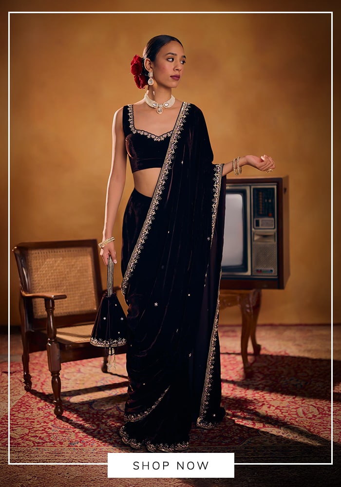 Navy blue velvet saree with potli