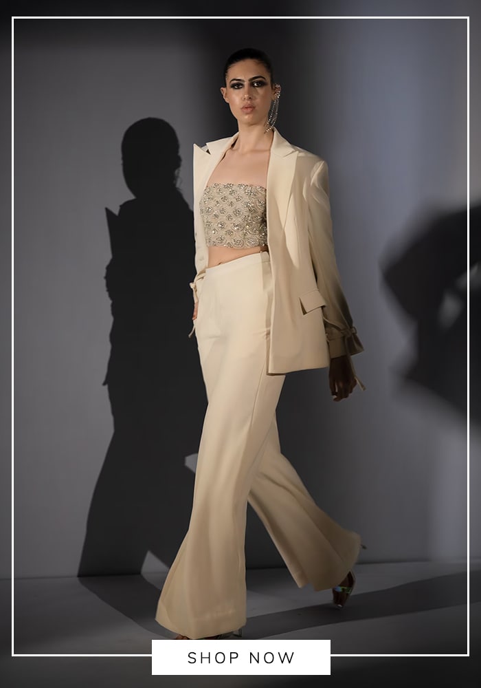 White blazer and flared pants