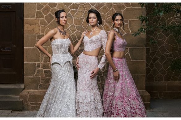 Three models wearing three different types of lehengas