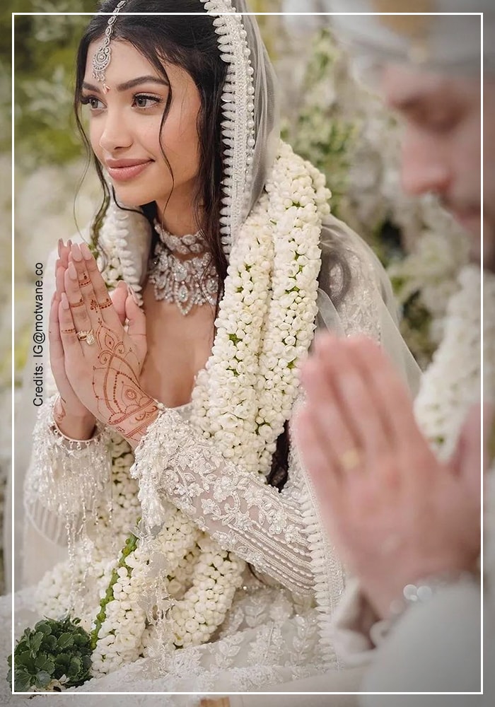 Alanna Panday in her ivory lehenga with her husband on her wedding day