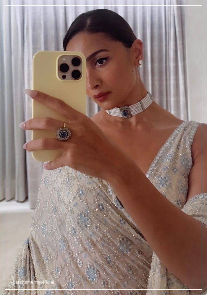 Alia Bhatt wearing ivory Arpita Mehta saree and Amrapali Jewels pearl choker and finger rings