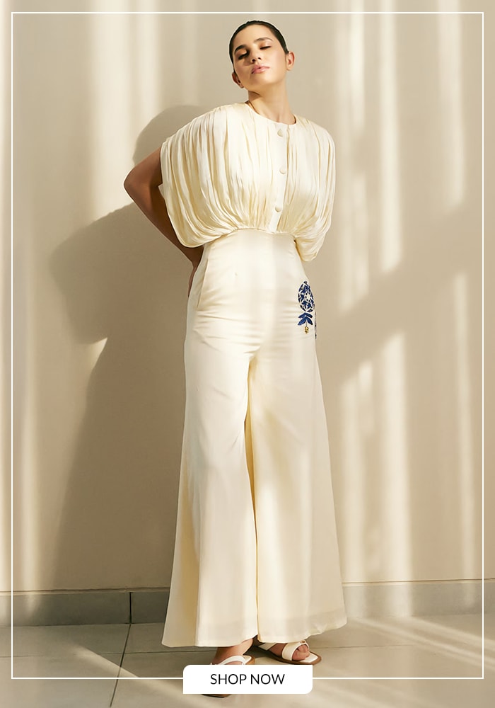 Model wearing ivory kaftan style jumpsuit