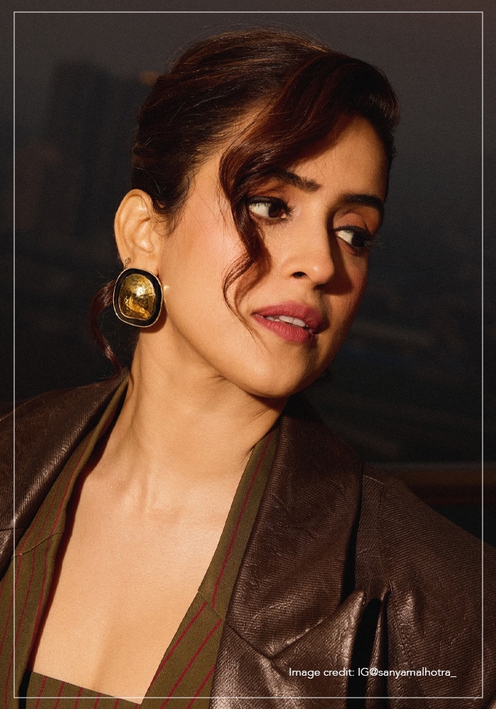 Sanya Malhotra wearing gold circular earrings