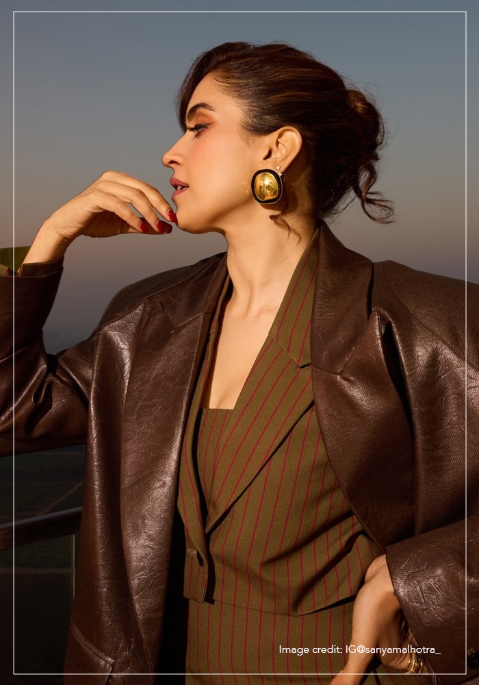 Sanya Malhotra gold earrings and brown outfit