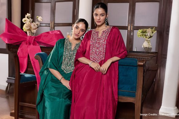Two models wearing green and pink kaftans