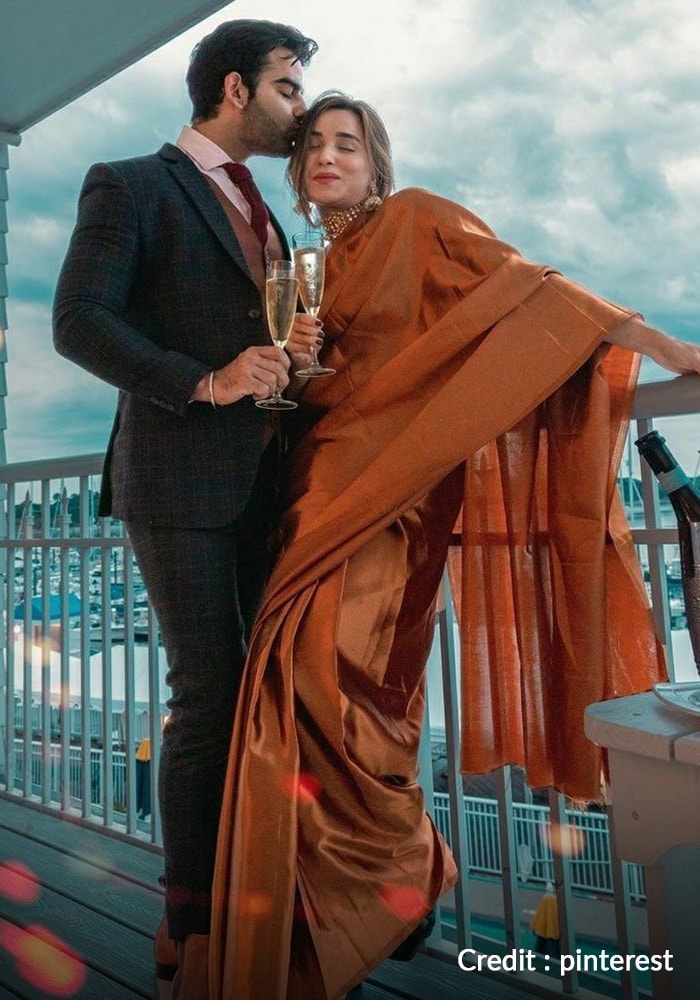 Indian couple drinking champagne
