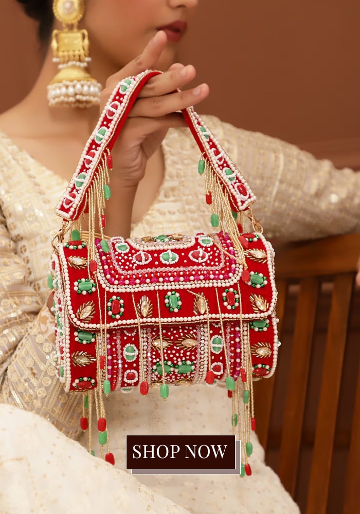 Red embellished bag with pearl and green beads and crystals