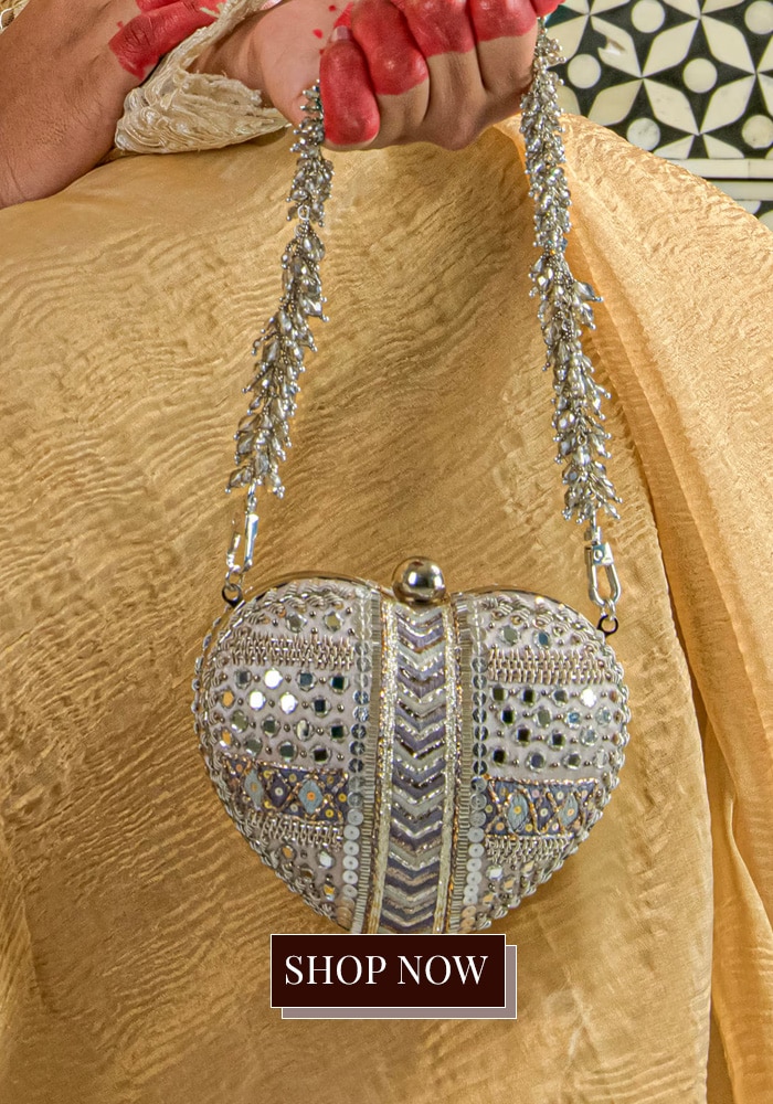 Heart shaped silver embellished sling bag