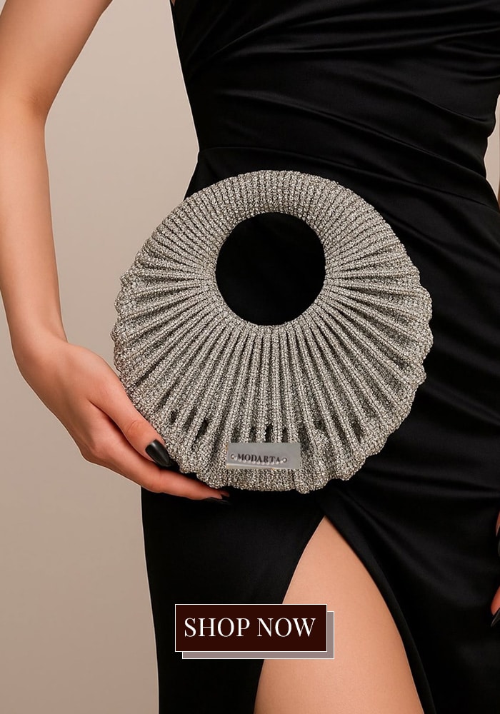 Silver crescent embellished clutch