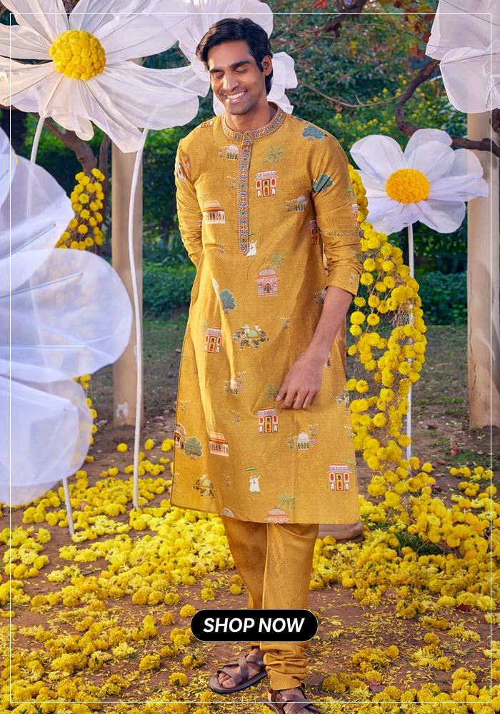Man posing in yellow printed kurta and matching pyjama set