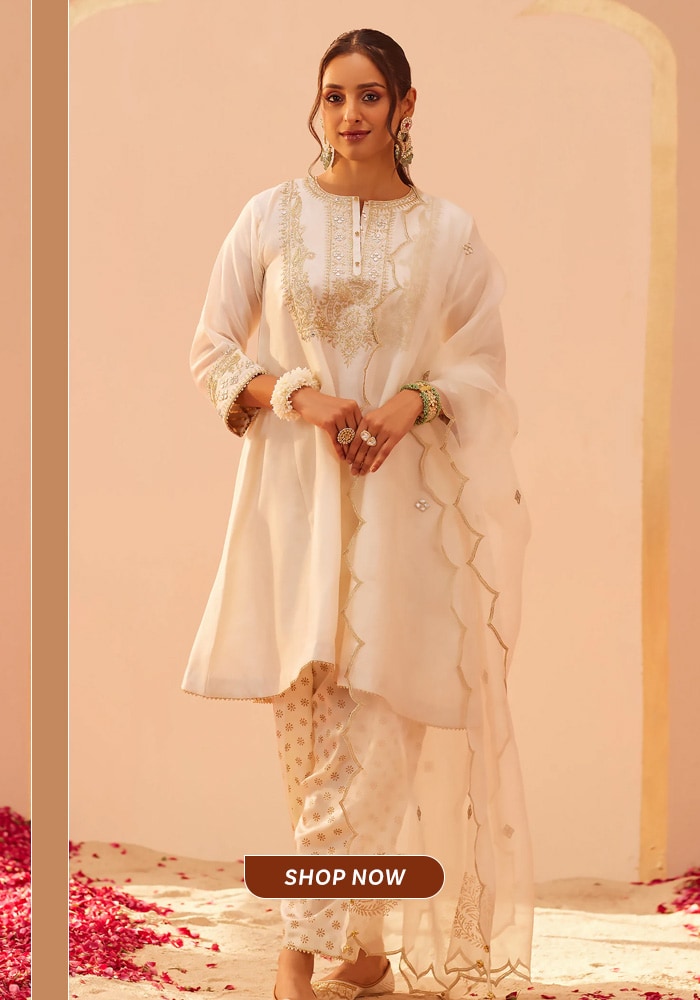 Ivory embroidered choga salwar suit with delicate gold detailing, styled as an elegant festive and daytime celebration look