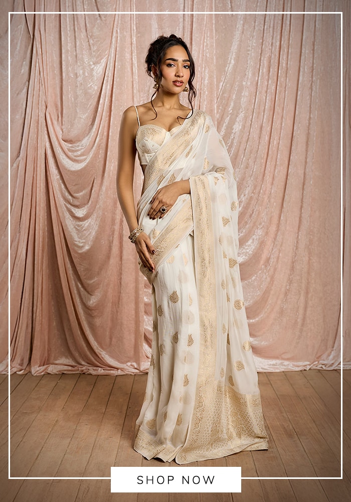 Ivory saree with gold motifs and soft sheer drape