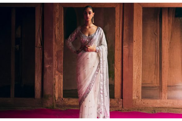 Model wearing a white embellished saree styled for Mahashivratri, reflecting minimal festive ethnic wear for women