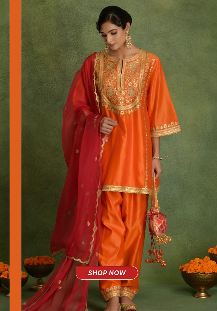 Orange and red embroidered choga salwar suit paired with a contrasting dupatta, ideal for festive and mehendi celebrations