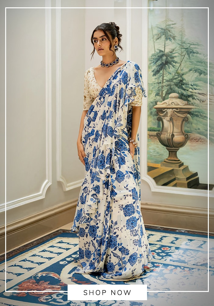 White saree with blue floral print and soft drape