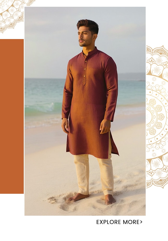 Rust saffron linen kurta for men with mandarin collar, styled barefoot with cream churidars on a white sand beach — Aza Fashions
