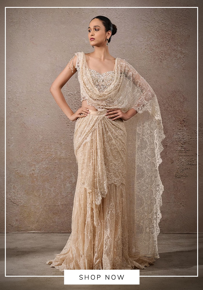 Tarun Tahiliani ivory all-over lace concept sari with pre-stitched drape, scalloped border, and embellished bodice — bridal and occasion wear 2024
