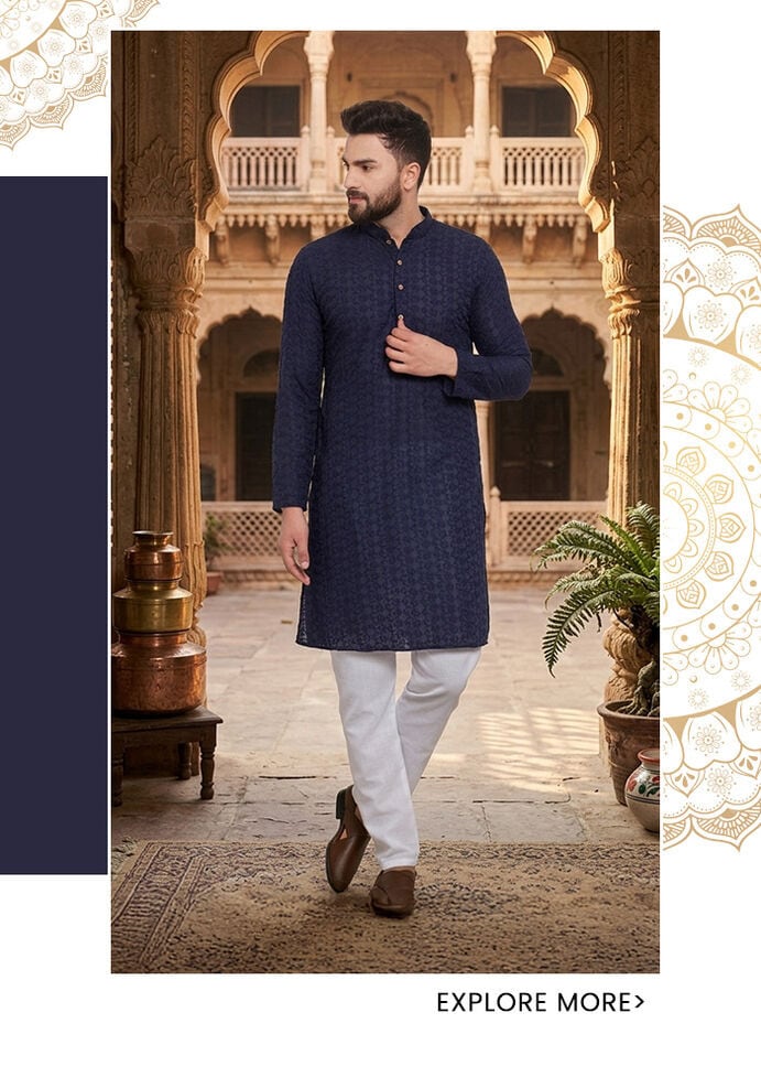 Midnight navy chikankari linen kurta for men with all-over thread embroidery, styled with white churidars and dark loafers at a Rajasthani heritage haveli — Aza Fashions