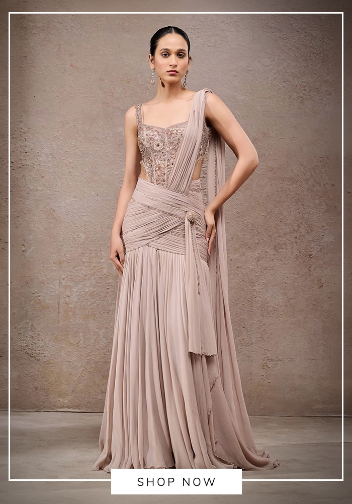 Tarun Tahiliani dusty rose pleated concept sari with embroidered corset top, pre-draped pallu, and flowy skirt — modern Indian occasion wear