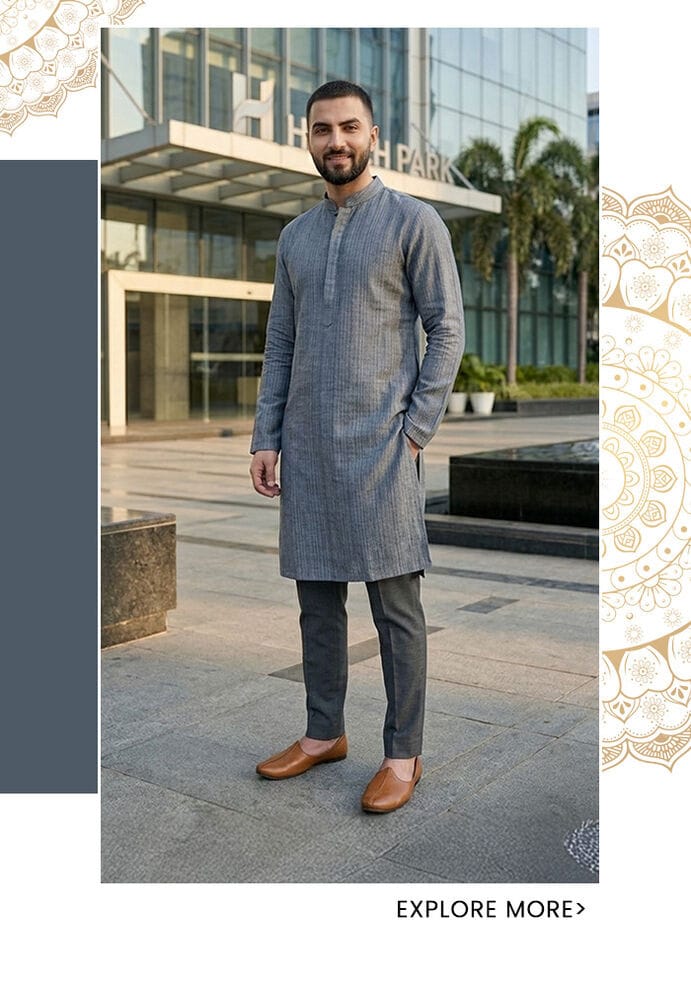 Slate grey textured linen kurta for men with subtle stripe weave, styled in a tonal look with dark trousers and tan loafers outside a modern corporate building — Aza Fashions