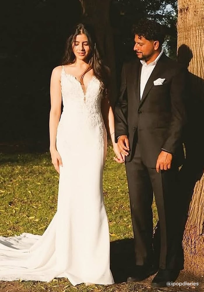 Kuldeep Yadav in black suit and Vanshika wearing white gown