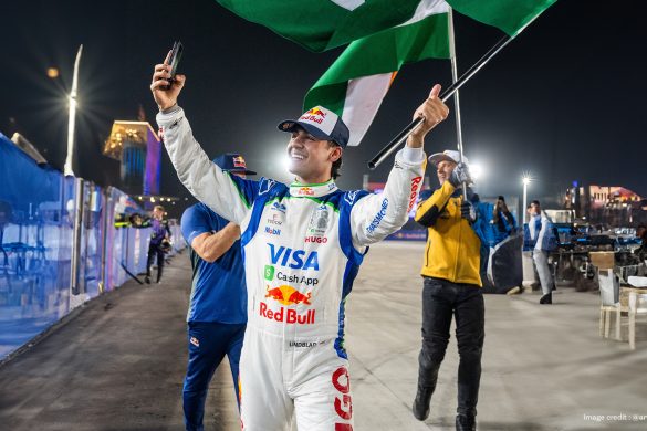 Arvid Lindblad holding flag