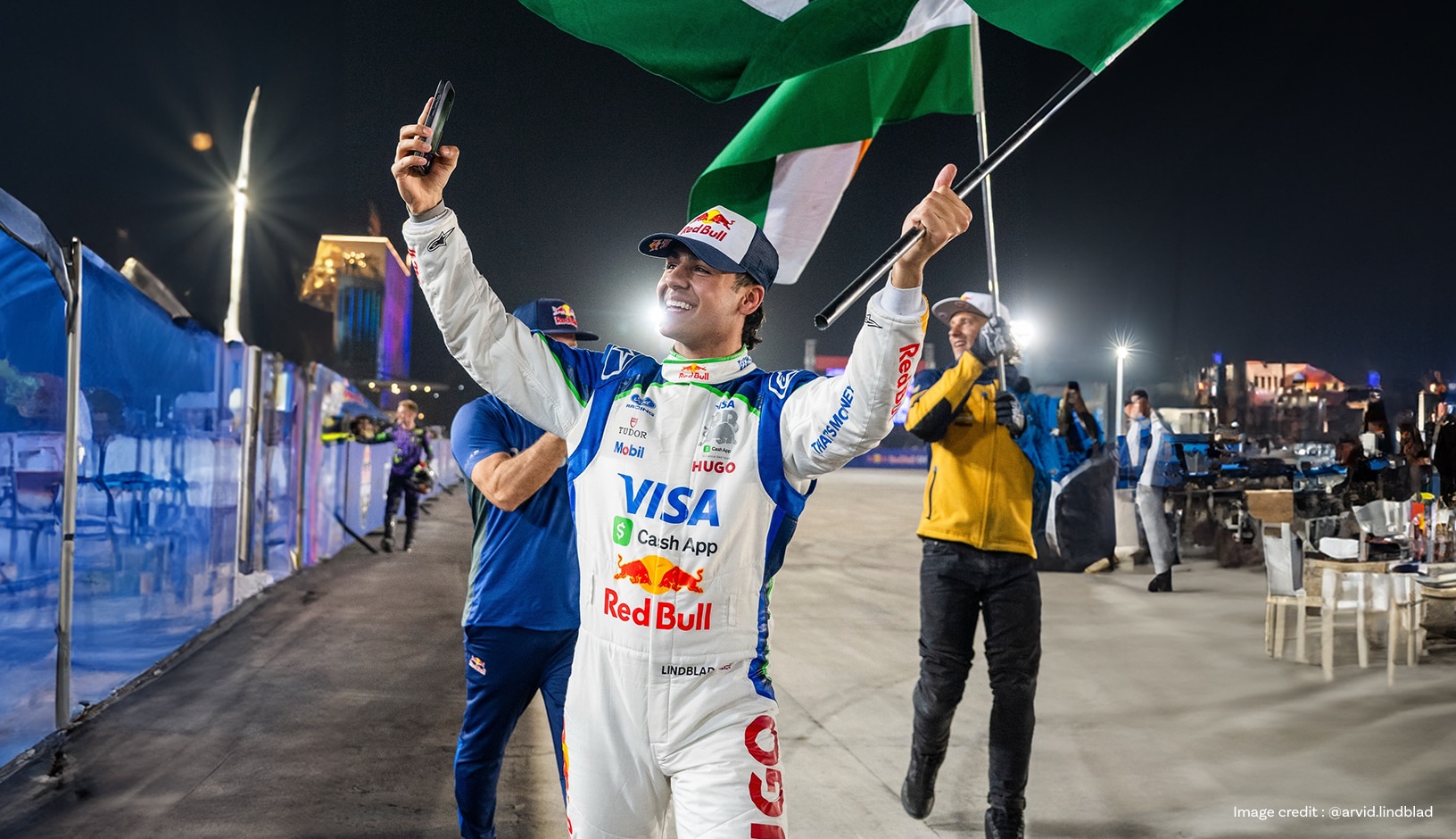 Arvid Lindblad holding flag